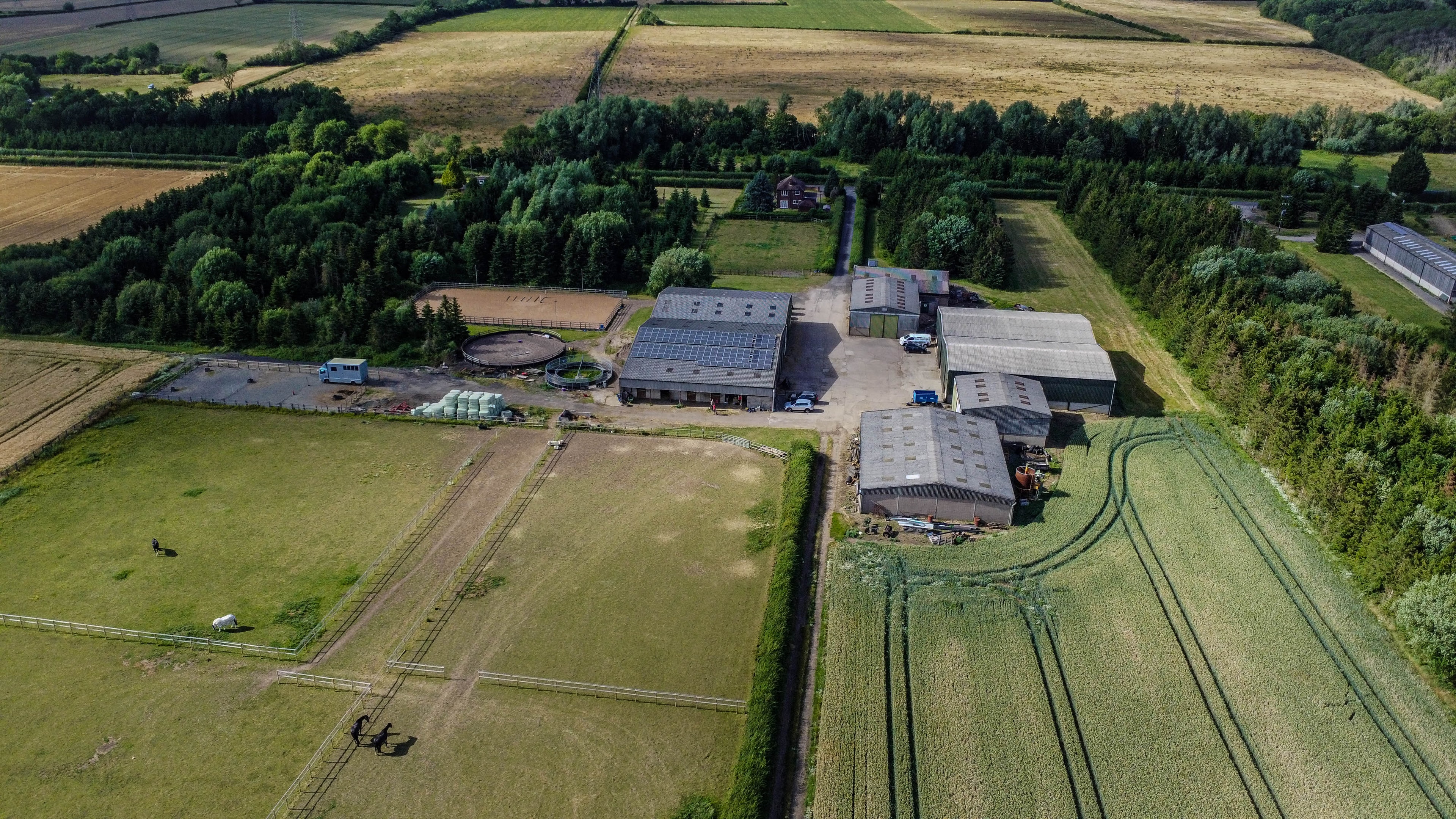 Aerial view of rural farmland with fields and hedgerows